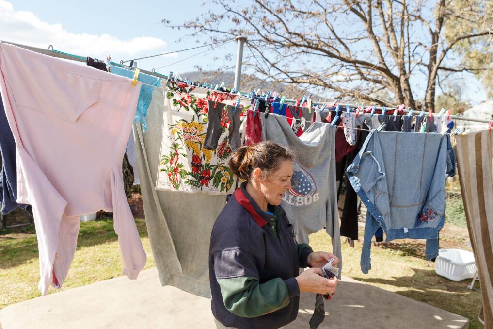 HIGH AND DRY: Murrurundi resident Ruth Roser puts another load of washing on the line. The family of eight has found a way to comply with tough water restrictions. Picture: Max Mason-Hubers 