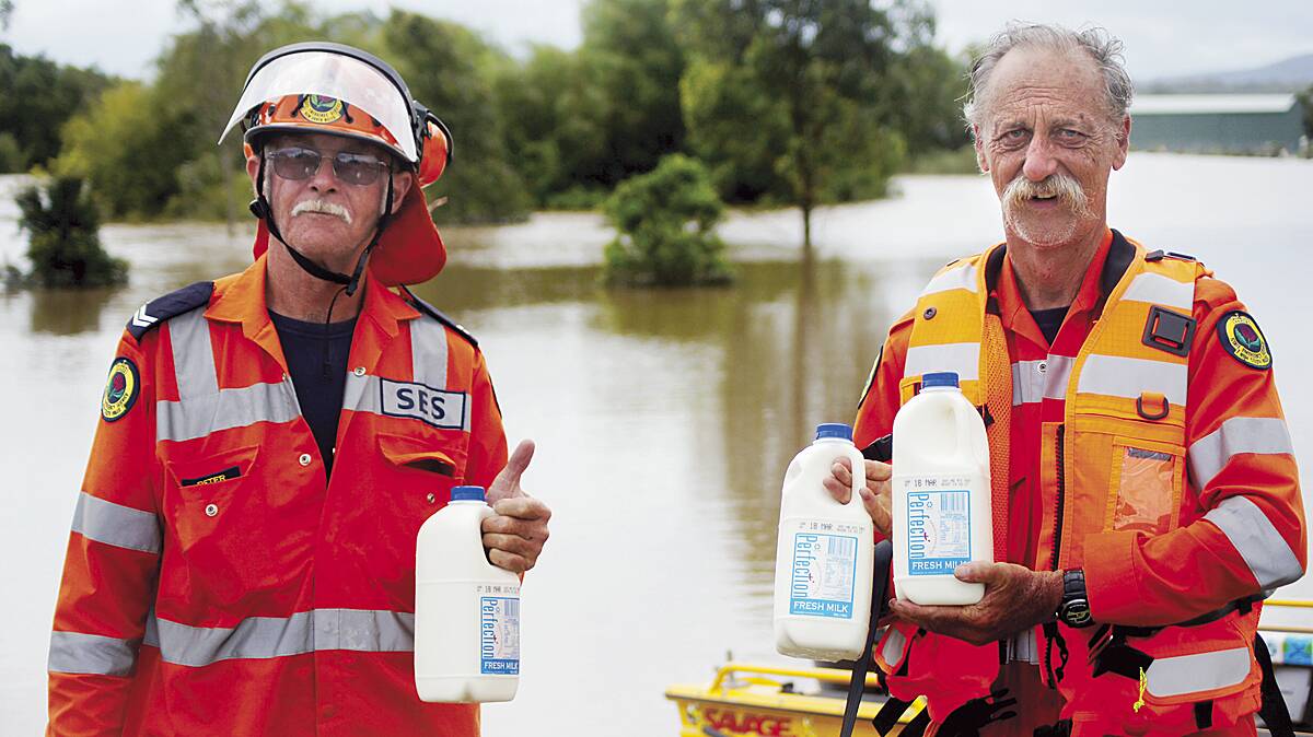 Volunteers Peter Sherwen and Greg Gunter wouldn’t hear of locals going without milk for their morning cuppa.