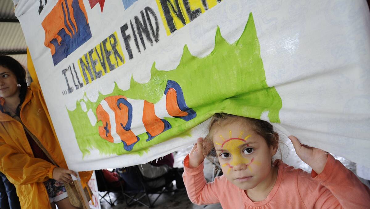 RALLYING TO THE CAUSE:  Elizabeth Dyer, 5, of Singleton was at the climate change rally with her mother Thoraiya, who wants Elizabeth to gow up to  experience the beauty of the Great Barrier Reef. 