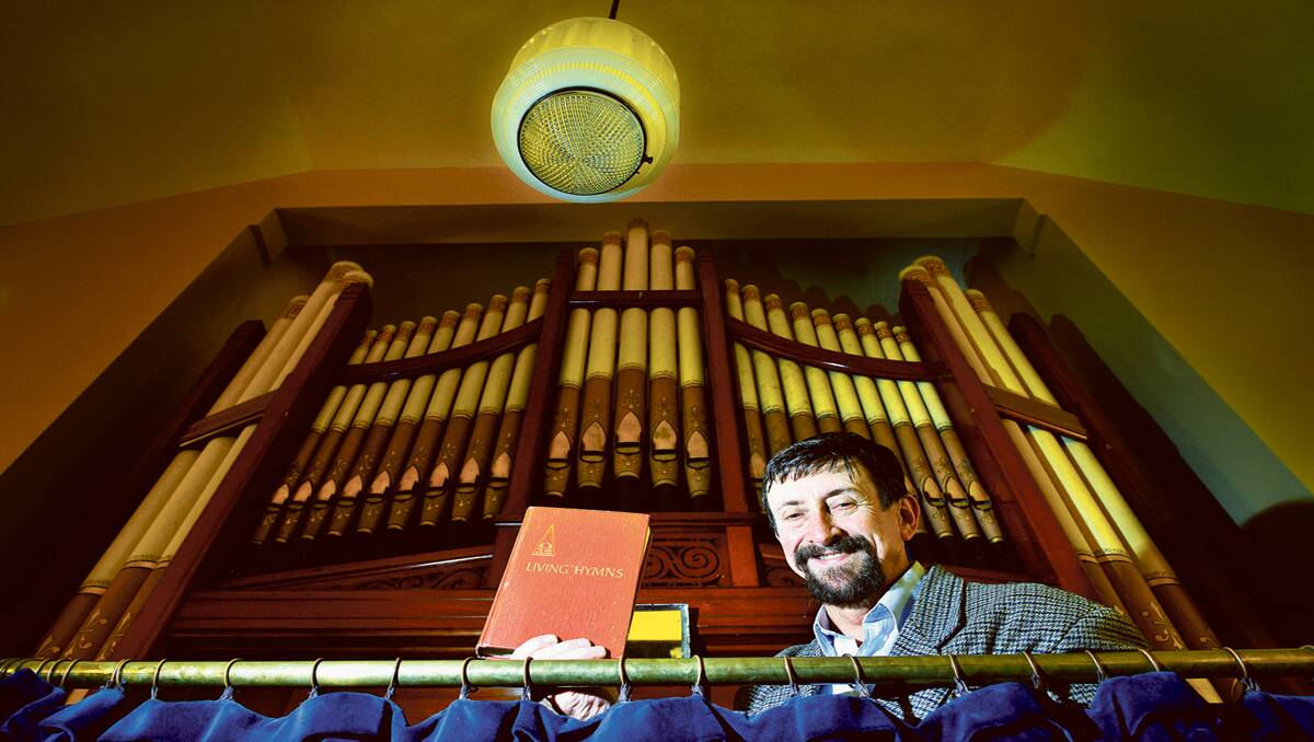 HELP NEEDED:  Reverend Gordon Peden and the historic organ that needs some tender loving care.   