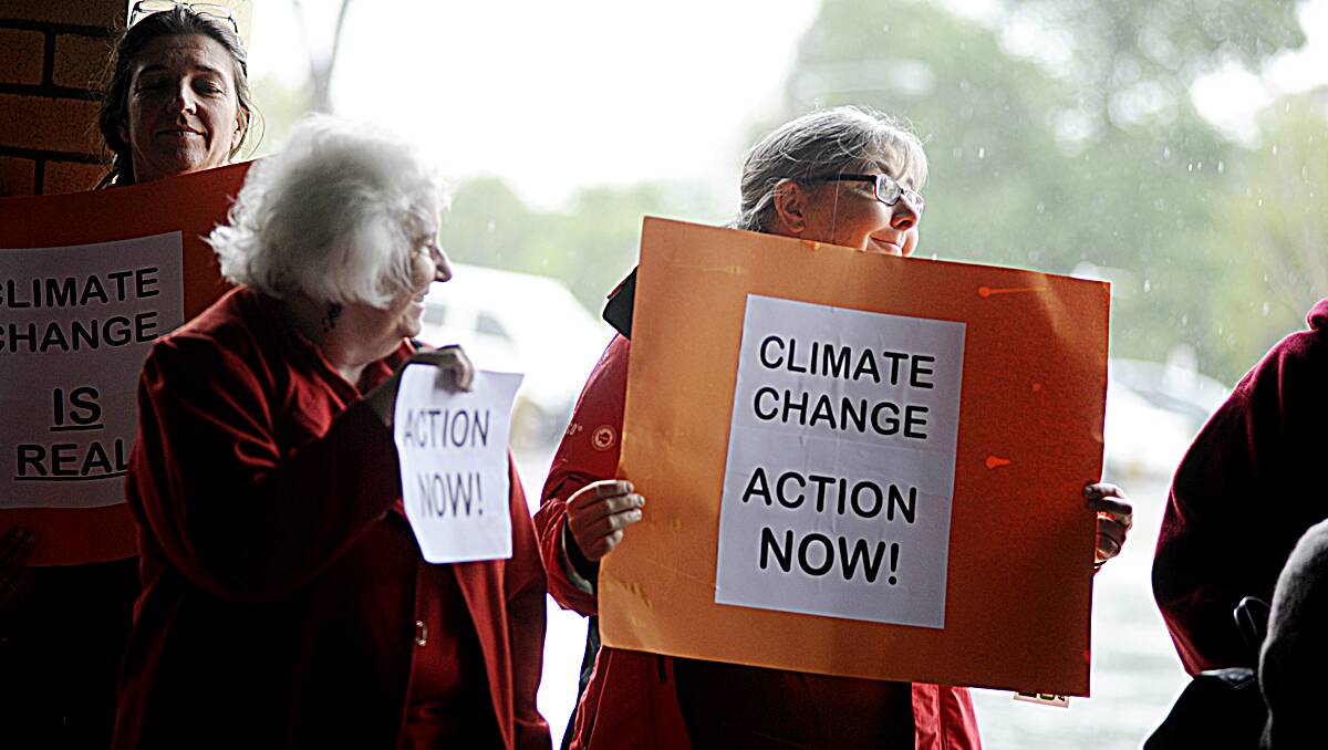 CLIMATE ACTION: About 80 people attended a rally at Maitland Park yesterday as part of the National Day of Climate Action.