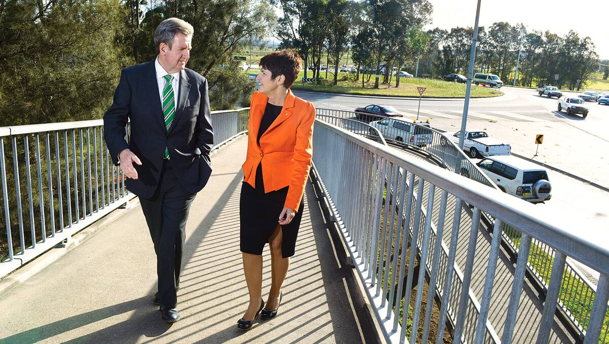 A GOOD SOLUTION:  Premier Barry O’Farrell with Member for Maitland Robyn Parker at the troublesome roundabout yesterday. Picture by STUART SCOTT