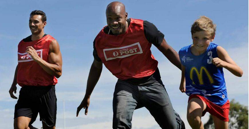 FUN TO RUN: Joshua Ross, Asafa Powell, and a friend, promoting the Stawell Gift earlier this week.